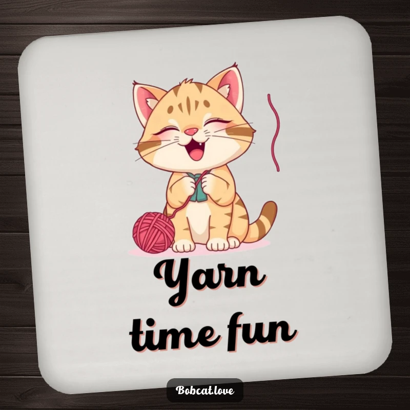 Funny bobcat coaster, a giggling cat batting at a dangling yarn ball, adding humorous flair and protecting tabletops with style.