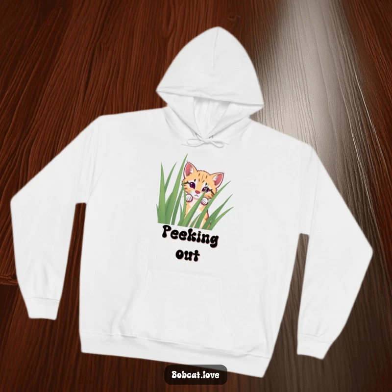 Funny curious bobcat hoodie, illustrating a peek from behind tall grass, perfect for cozy wear.