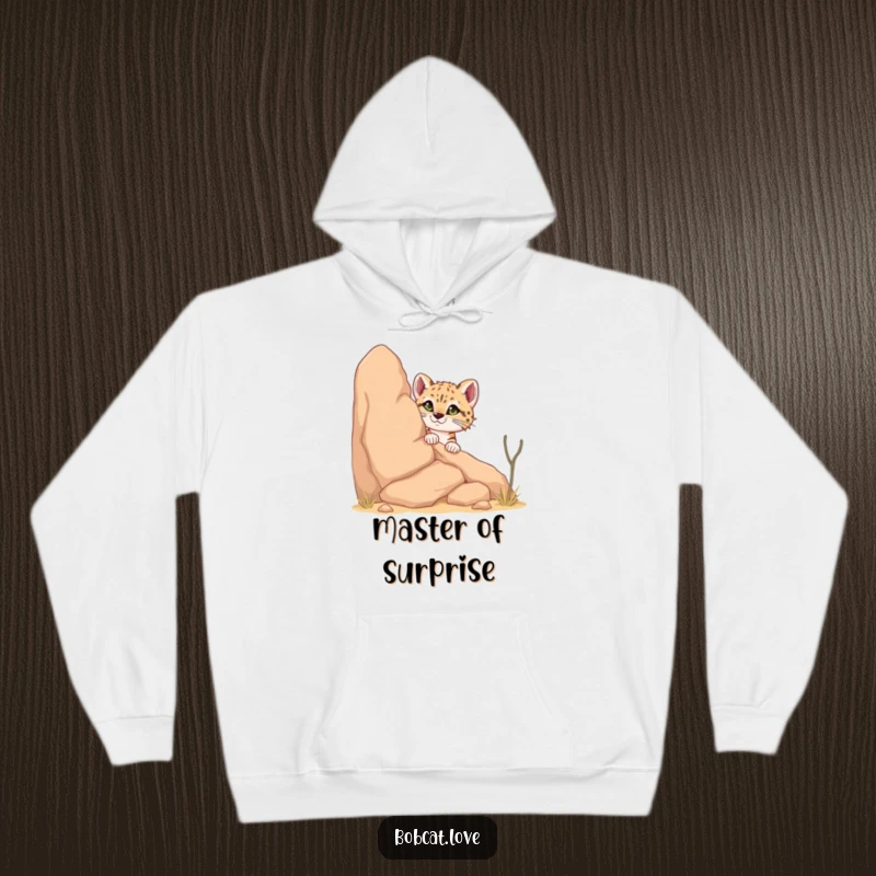 Funny Bobcat Hoodie: A curious bobcat humorously peeking from behind a desert rock, embodying a playful and adventurous spirit in a warm, comfortable design.